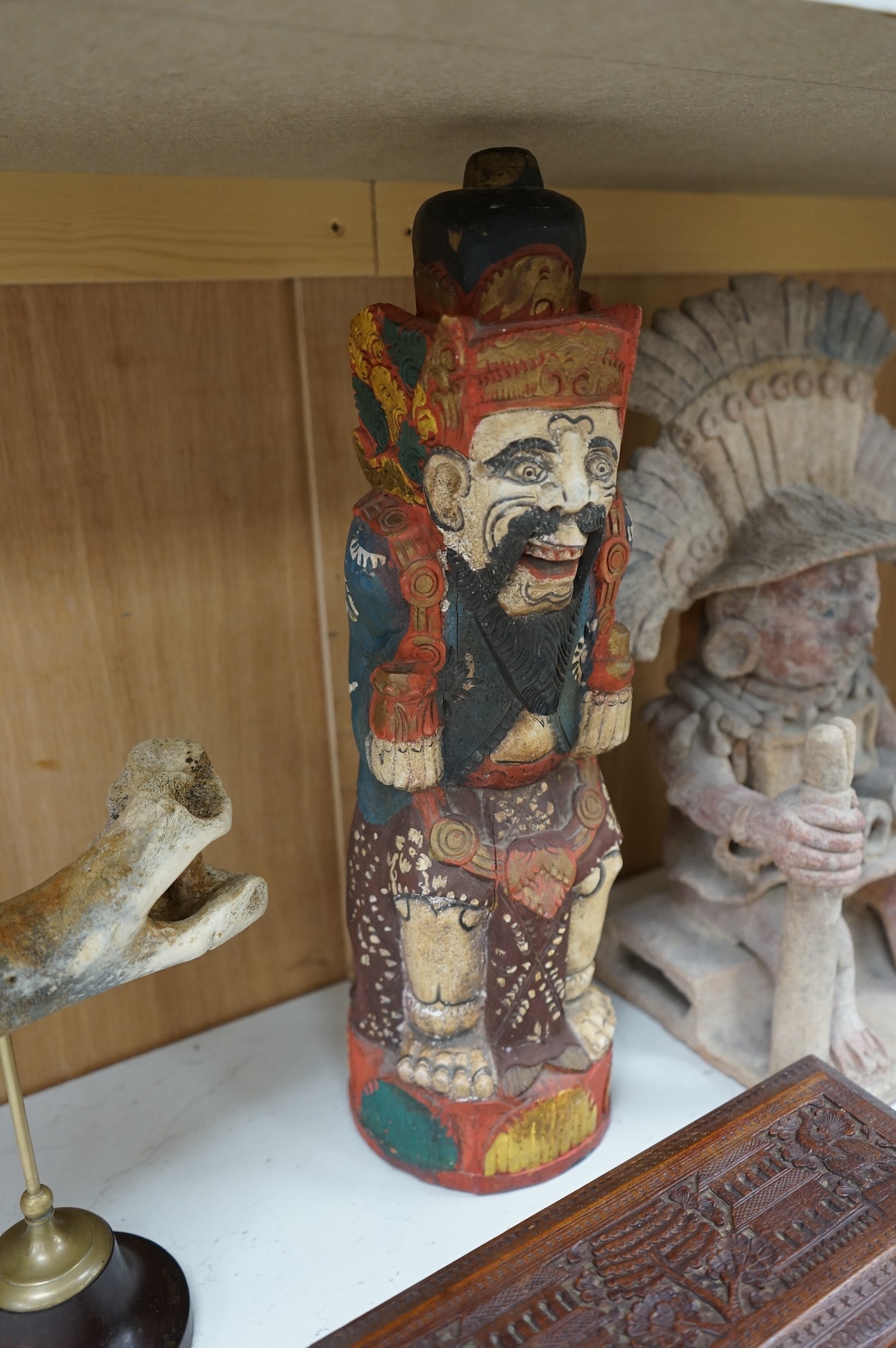 Eight south-east Asian carvings and a mounted bone, tallest 43cm